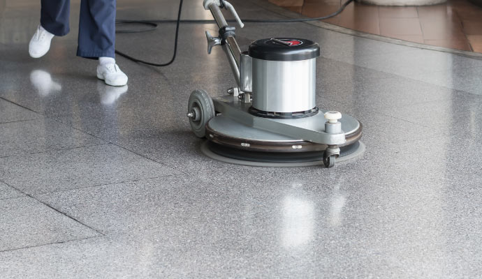 professional worker cleaning floor