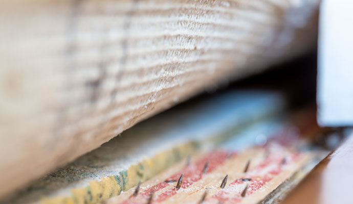 a carpet tack strip with exposed tacks