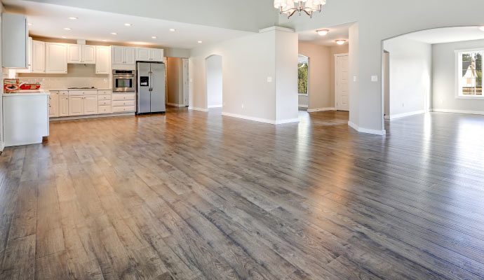 kitchen and living room area with laminate flooring.