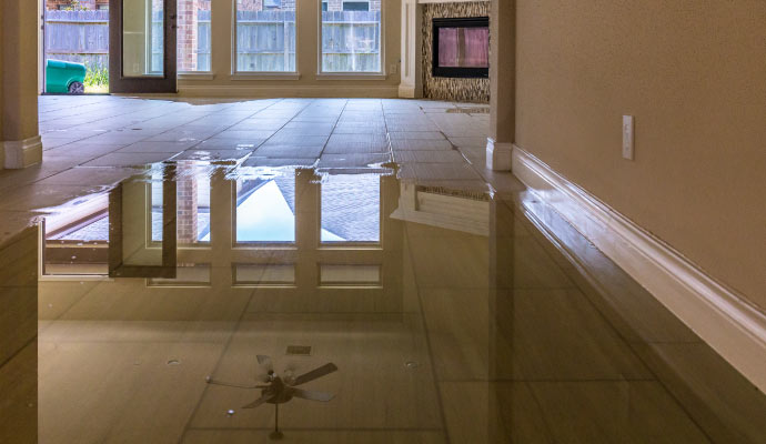 A flooded tile floor in a room